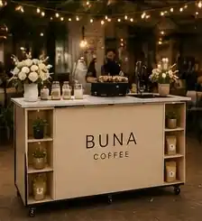 Cream BUNA cart with flowers under string lights at a wedding